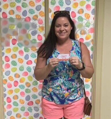 Young woman holding giftcard
