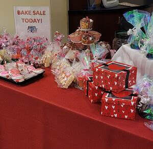 Baked items packaged and sitting on table for Bake Sale