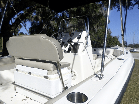 Backside of boat with nice seats and overhead covering